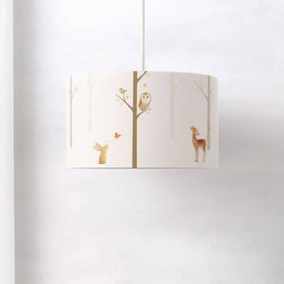 Side view of woodland lampshade with animal illustrations by Ginger Betty for nursery decor
