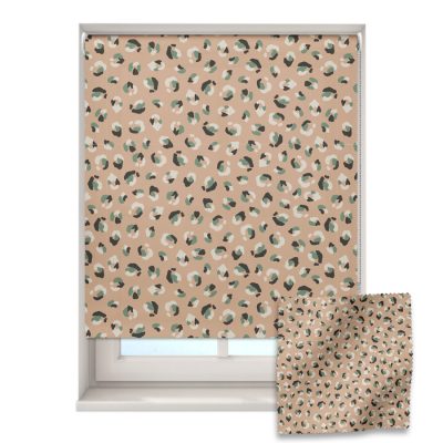 earthy leopard print roller blind on a window with a fabric swatch in front