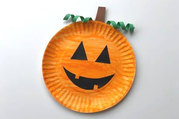 Paper plate pumpkins with orange black and green perfect Halloween craft ideas for children