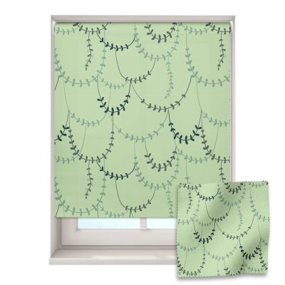 jungle vines roller blind on a window with a fabric swatch in front